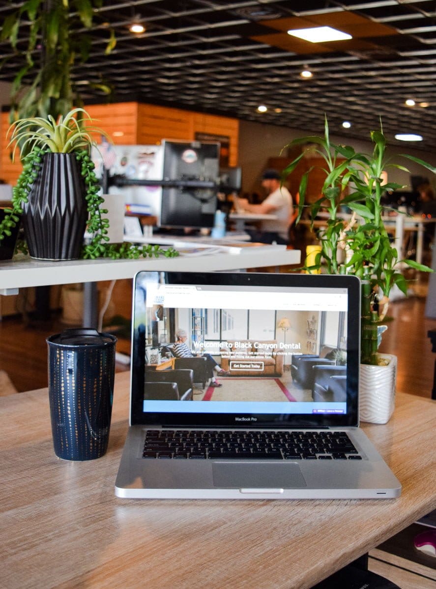 bcd-desk-laptop-coffee-mug Man Performing Google Search for Colorado Personal Injury Lawyers